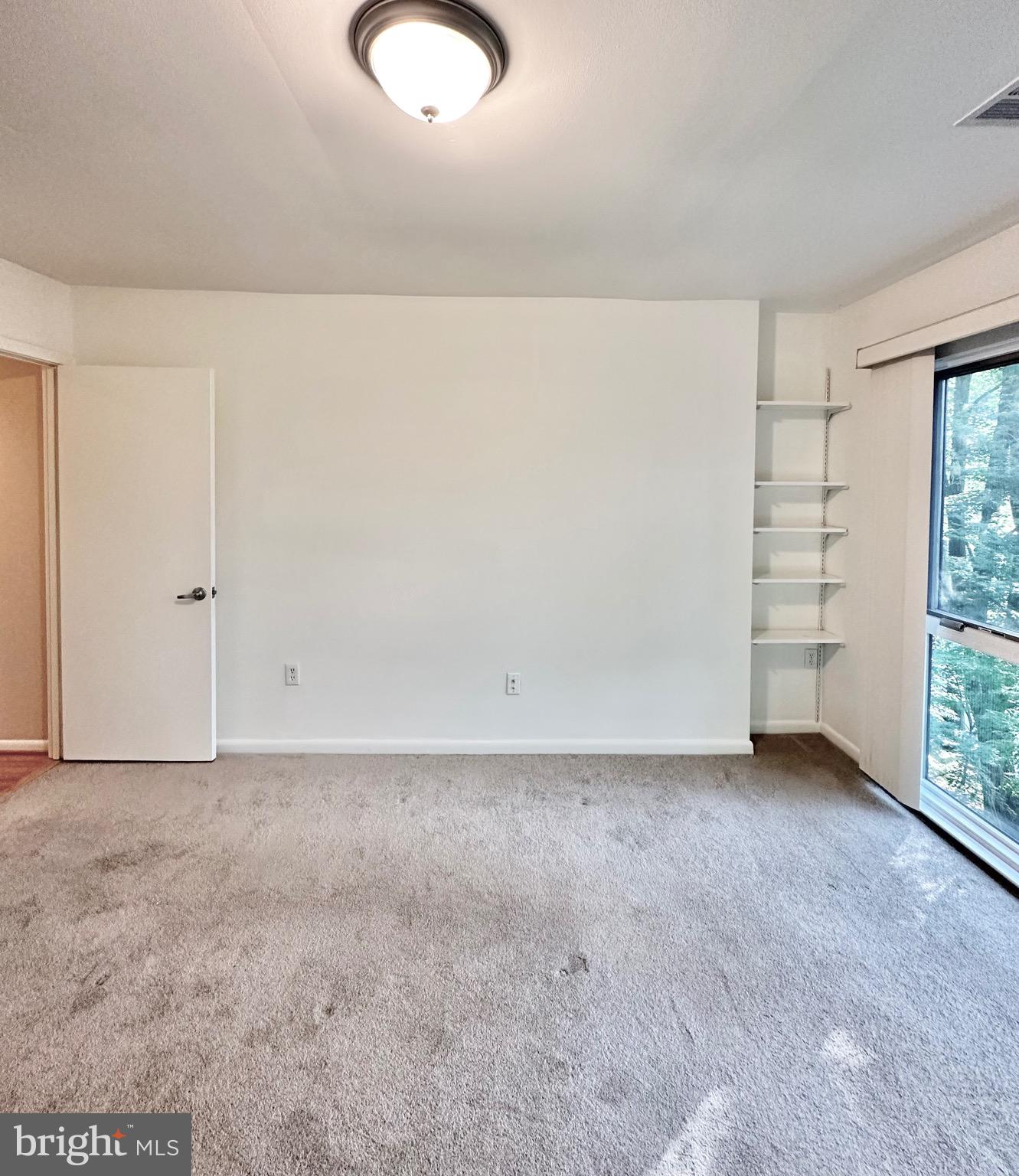 2021 Lakebreeze Way Reston, VA 20191 - Photo 33 of 51 a view of an empty room with a window