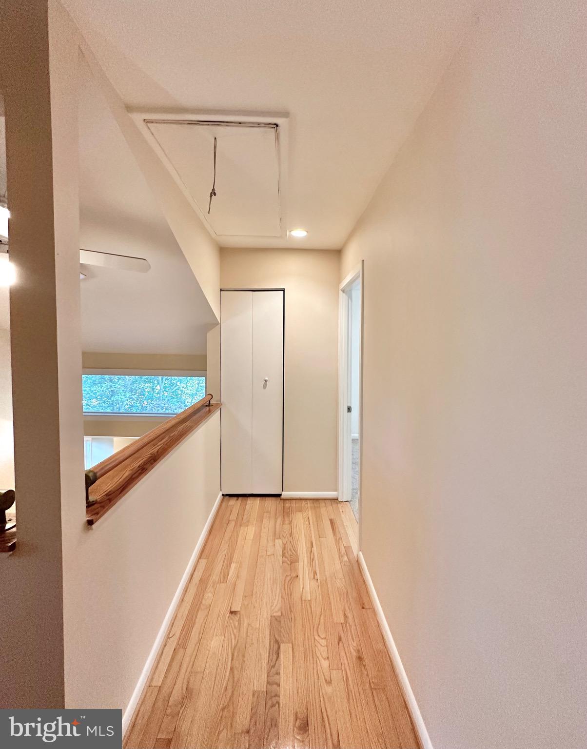 2021 Lakebreeze Way Reston, VA 20191 - Photo 35 of 51 a view of hallway with wooden floor