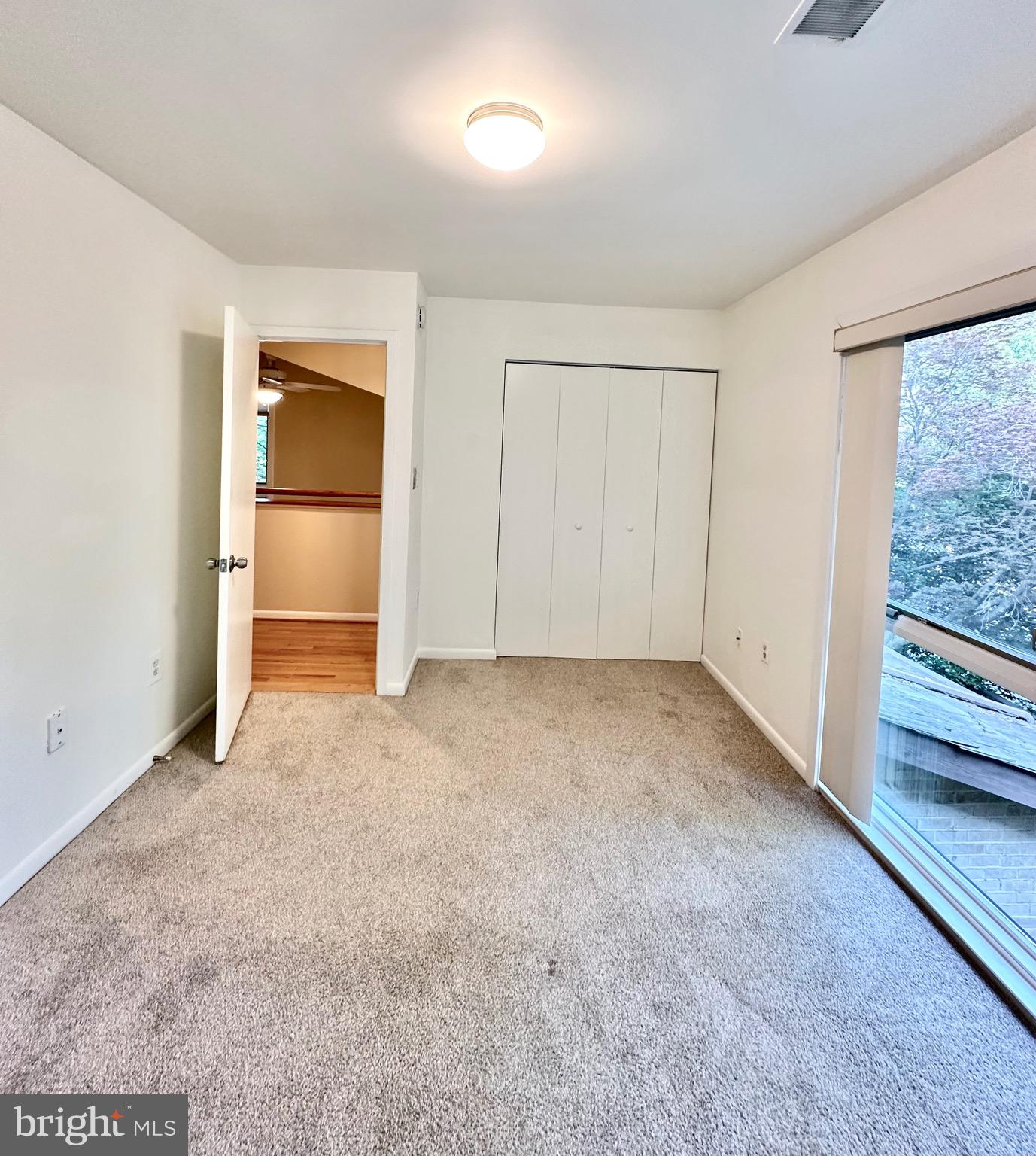 2021 Lakebreeze Way Reston, VA 20191 - Photo 37 of 51 an empty room with closet and windows