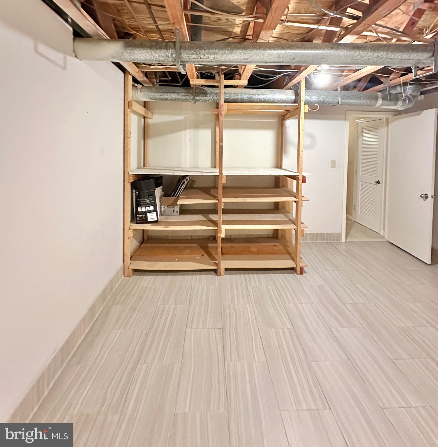 2021 Lakebreeze Way Reston, VA 20191 - Photo 40 of 51 a view of a room with wooden floor