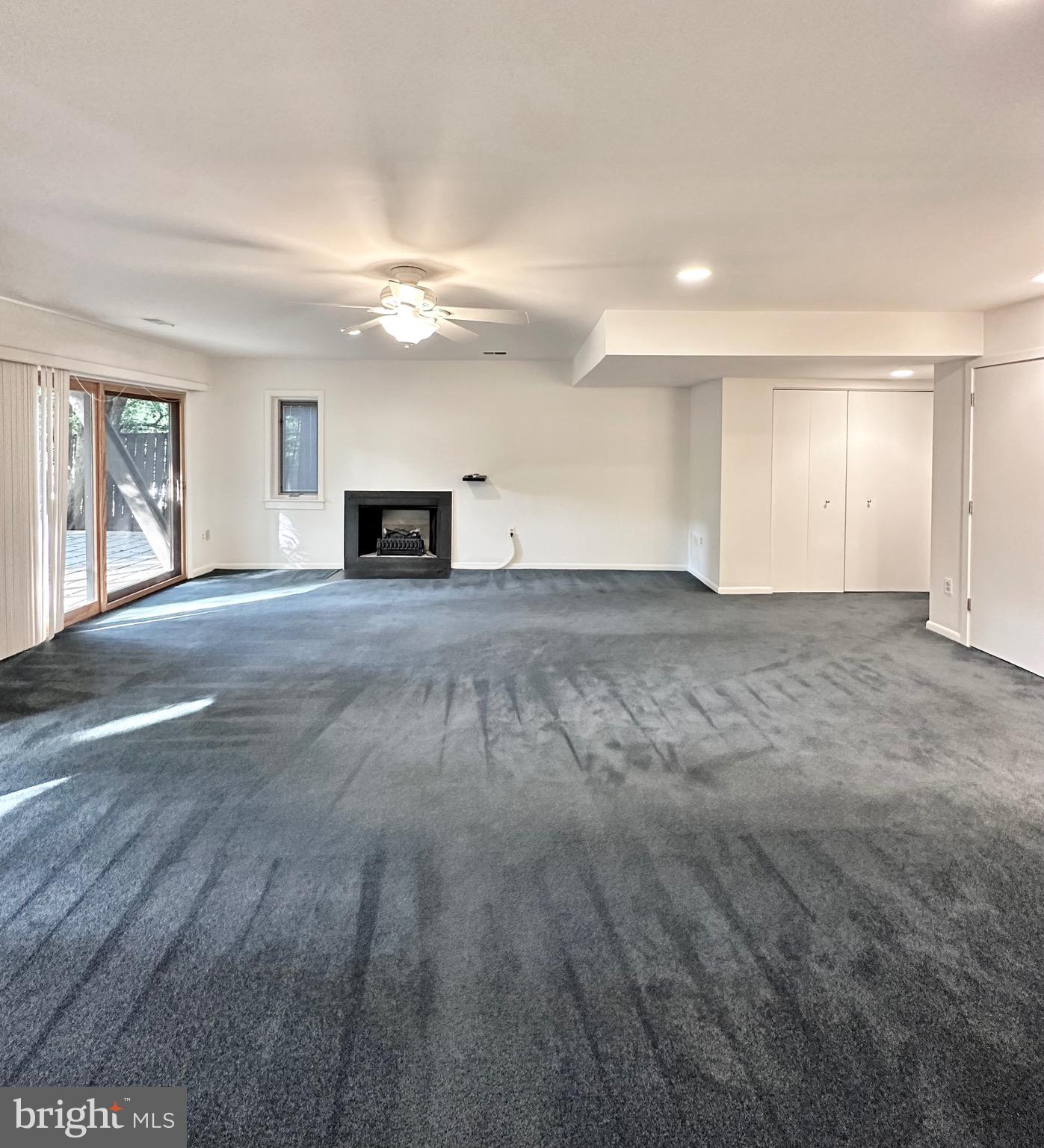 2021 Lakebreeze Way Reston, VA 20191 - Photo 43 of 51 a view of empty room with wooden floor and fireplace
