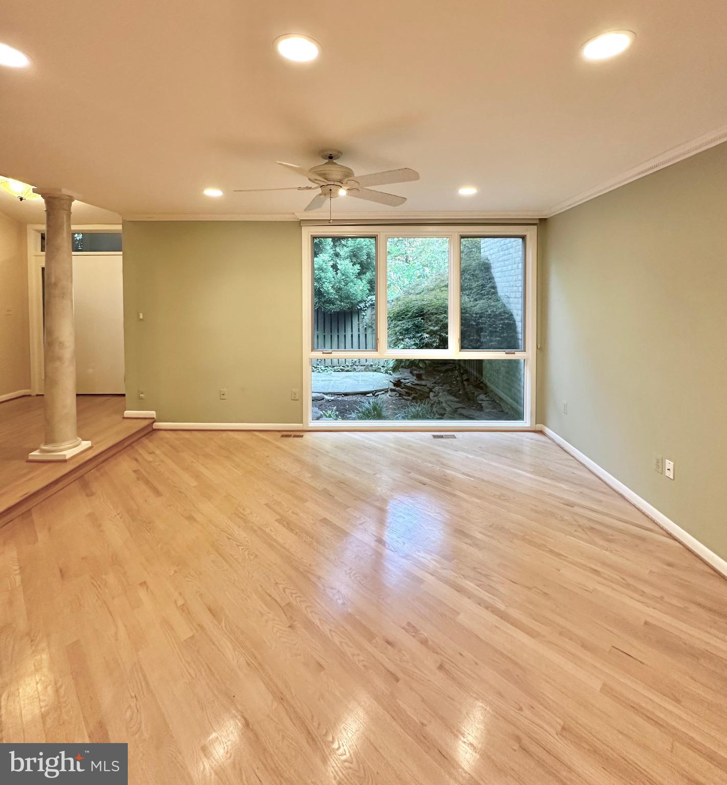 2021 Lakebreeze Way Reston, VA 20191 - Photo 7 of 51 a view of an empty room with wooden floor and a window