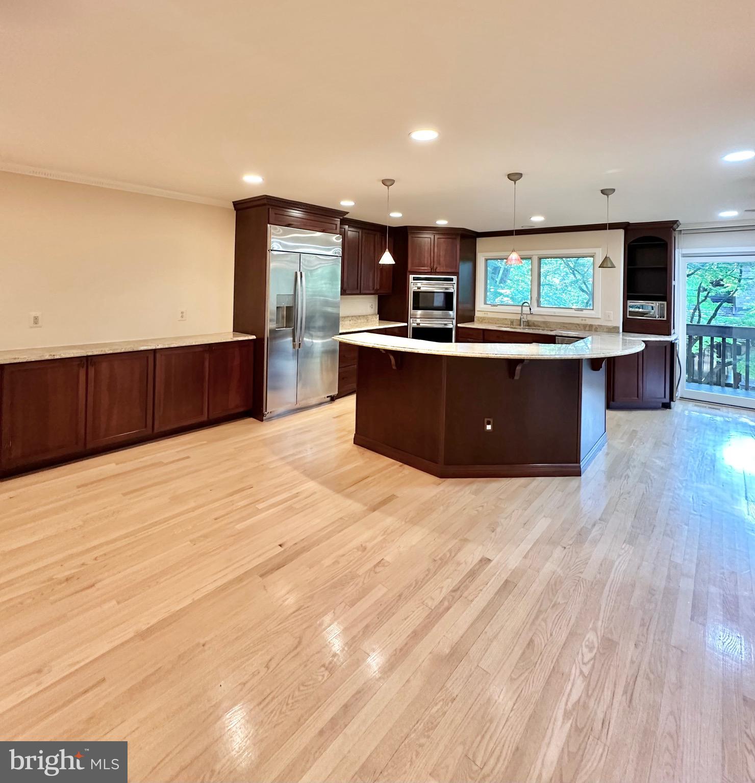2021 Lakebreeze Way Reston, VA 20191 - Photo 10 of 51 a kitchen with stainless steel appliances kitchen island sink refrigerator and stove