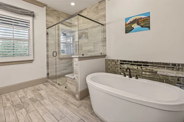 a bathroom with double sink and a mirror