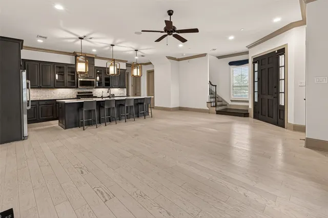 a view of a room with furniture and window