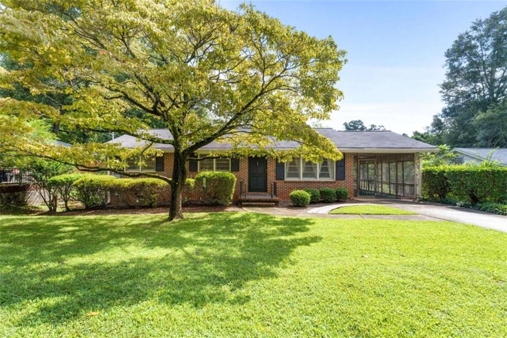 1529 Delia Drive Decatur, GA 30033 - Photo 1 of 1 a front view of a house with a garden