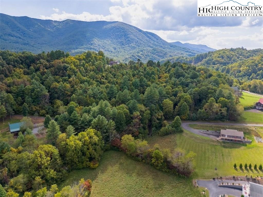 Stoney Brook Drive Lansing, NC 28643 - Photo 6 of 25 a view of a lake with a mountain in the background