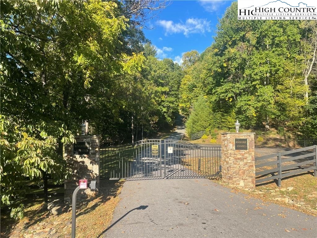 Stoney Brook Drive Lansing, NC 28643 - Photo 8 of 25 a view of a yard with plants and a bench