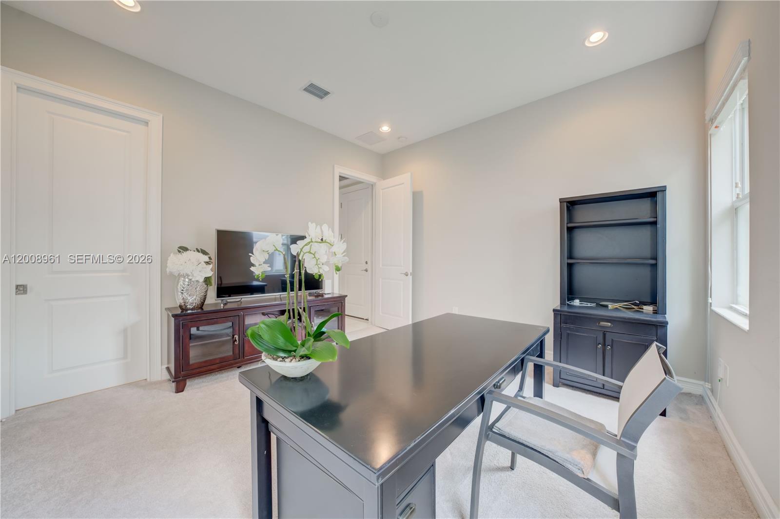 11655 Windy Frst Way Boca Raton, FL 33498 - Photo 13 of 47 a living room with furniture a flat screen tv and a potted plant
