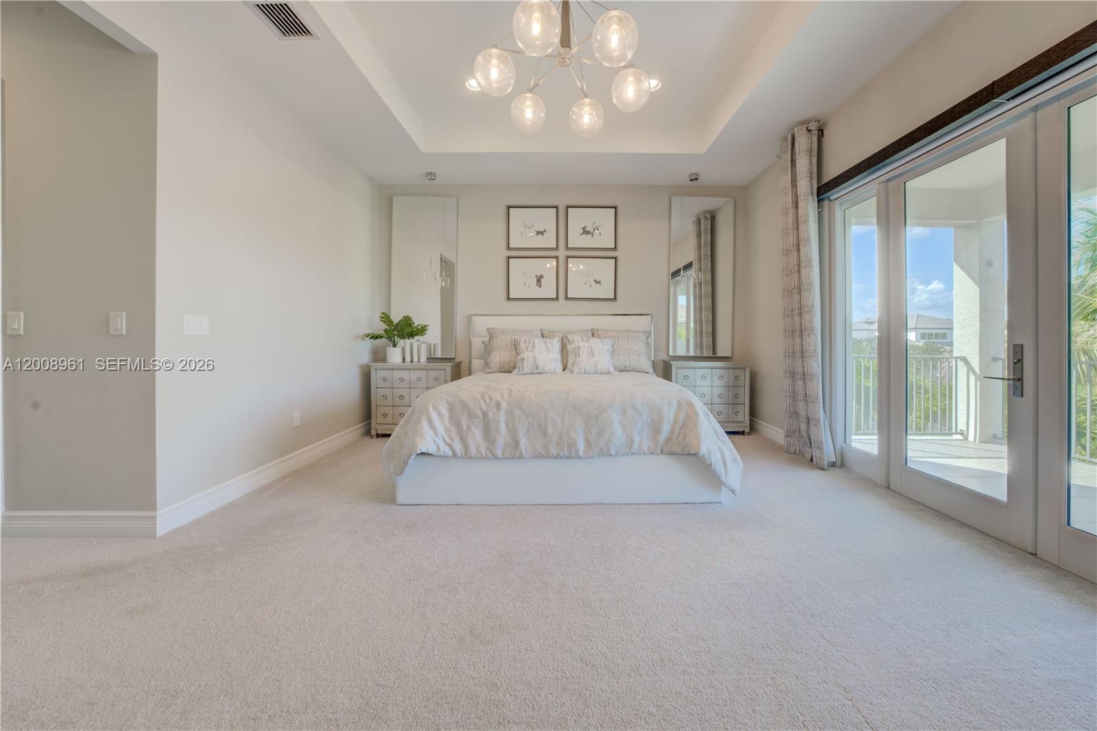 11655 Windy Frst Way Boca Raton, FL 33498 - Photo 18 of 47 a bedroom with a large bed and a large window