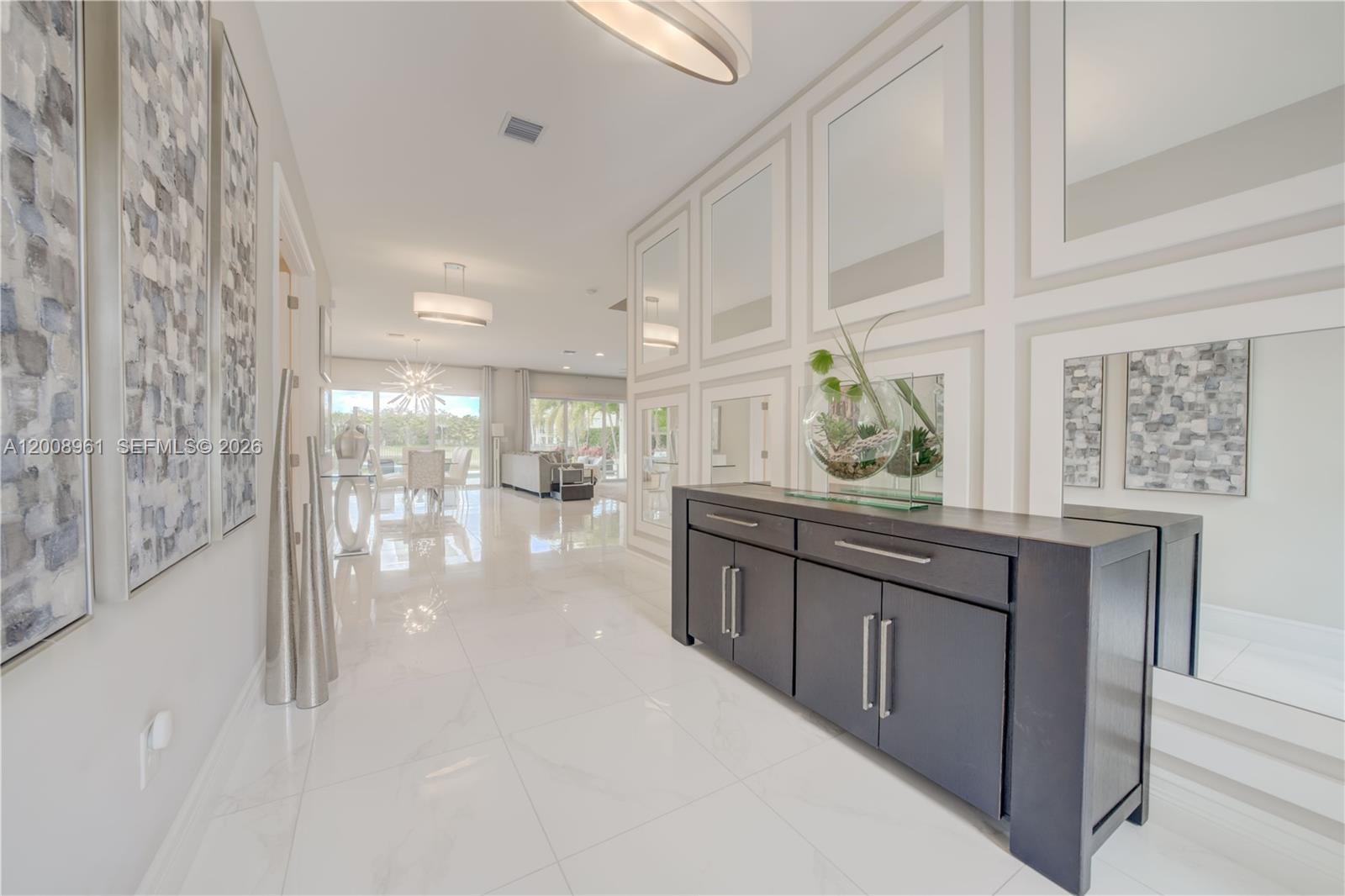 11655 Windy Frst Way Boca Raton, FL 33498 - Photo 22 of 47 a kitchen with stainless steel appliances granite countertop a stove a sink and a refrigerator