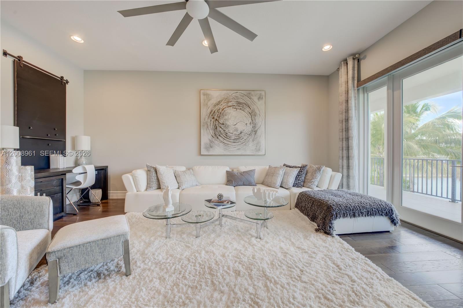 11655 Windy Frst Way Boca Raton, FL 33498 - Photo 28 of 47 a living room with furniture and a flat screen tv