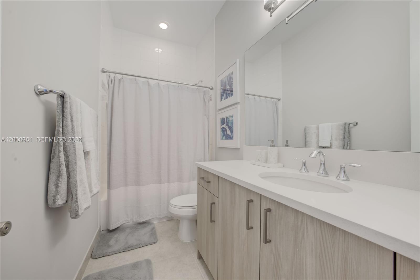 11655 Windy Frst Way Boca Raton, FL 33498 - Photo 33 of 47 a bathroom with a granite countertop sink a toilet and shower