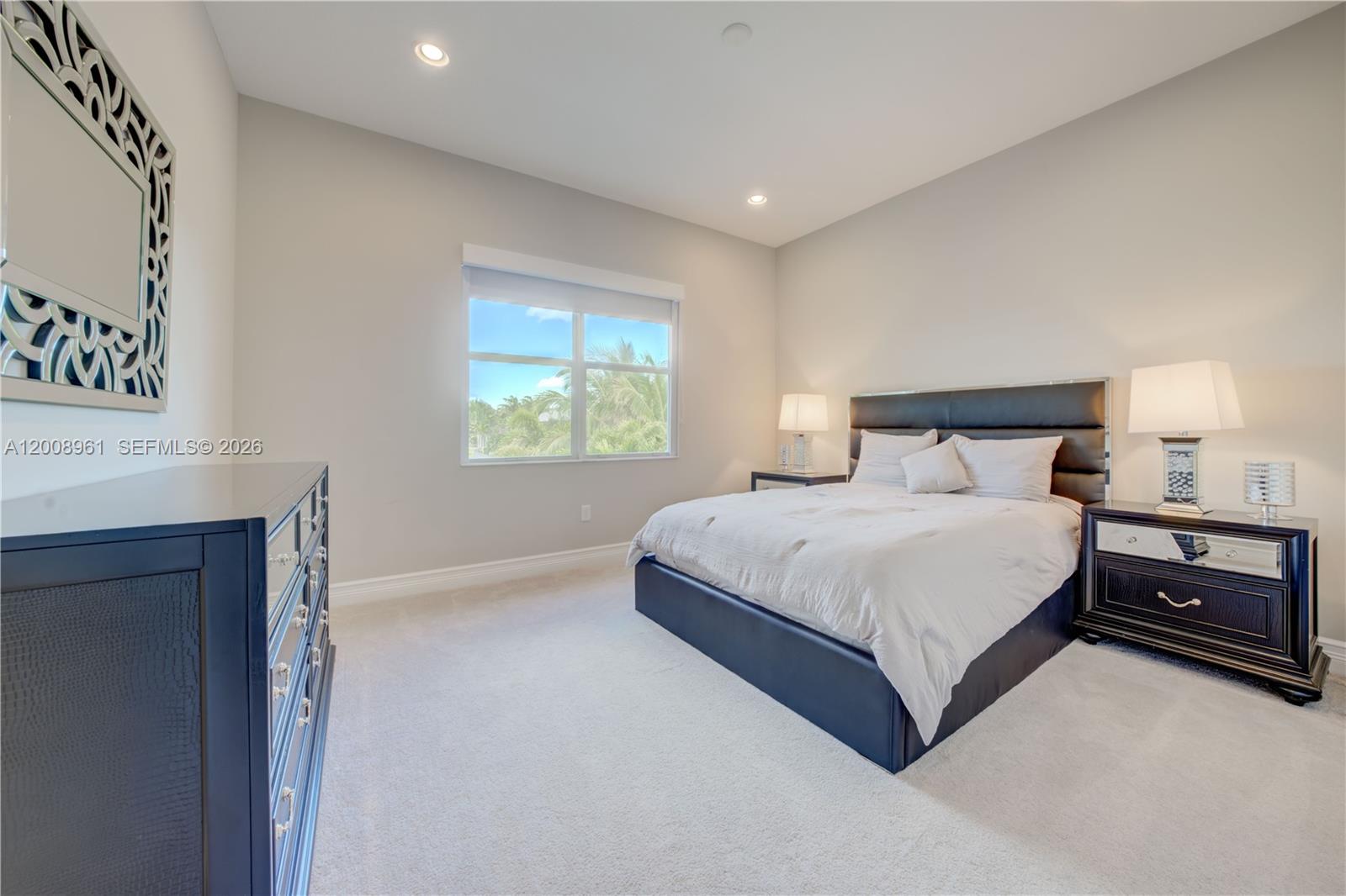 11655 Windy Frst Way Boca Raton, FL 33498 - Photo 34 of 47 a bedroom with a bed and a window