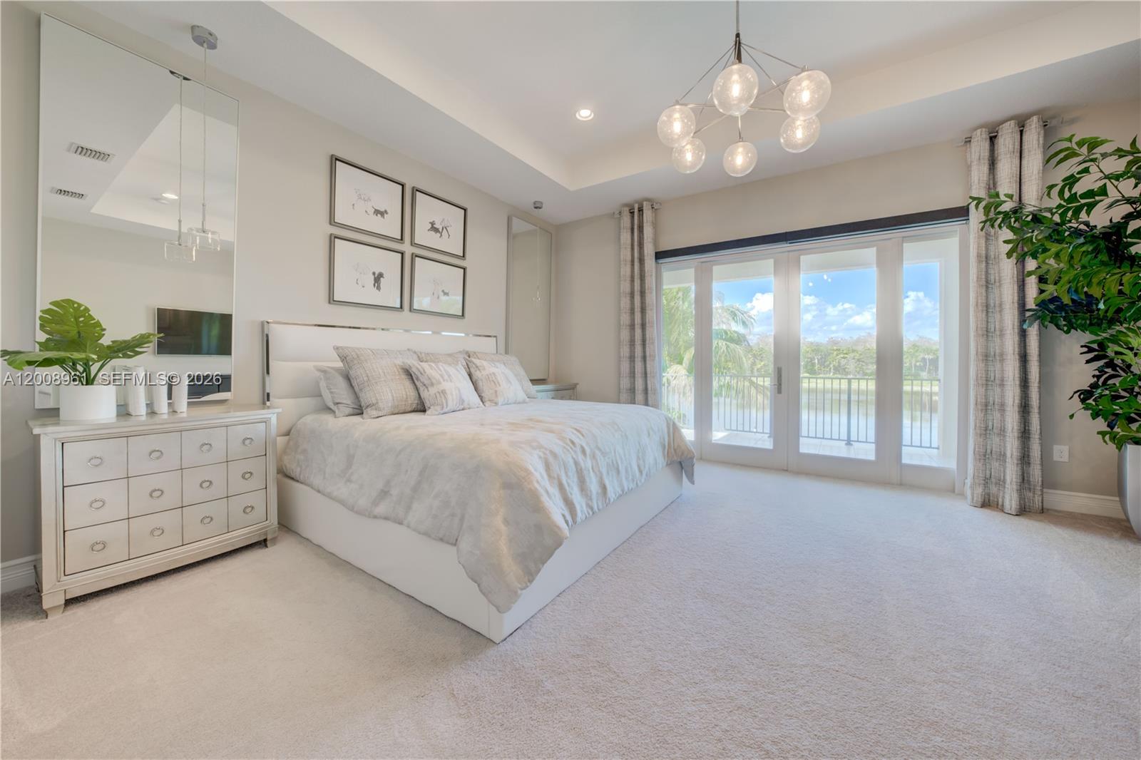 11655 Windy Frst Way Boca Raton, FL 33498 - Photo 37 of 47 a spacious bedroom with a large bed and a window