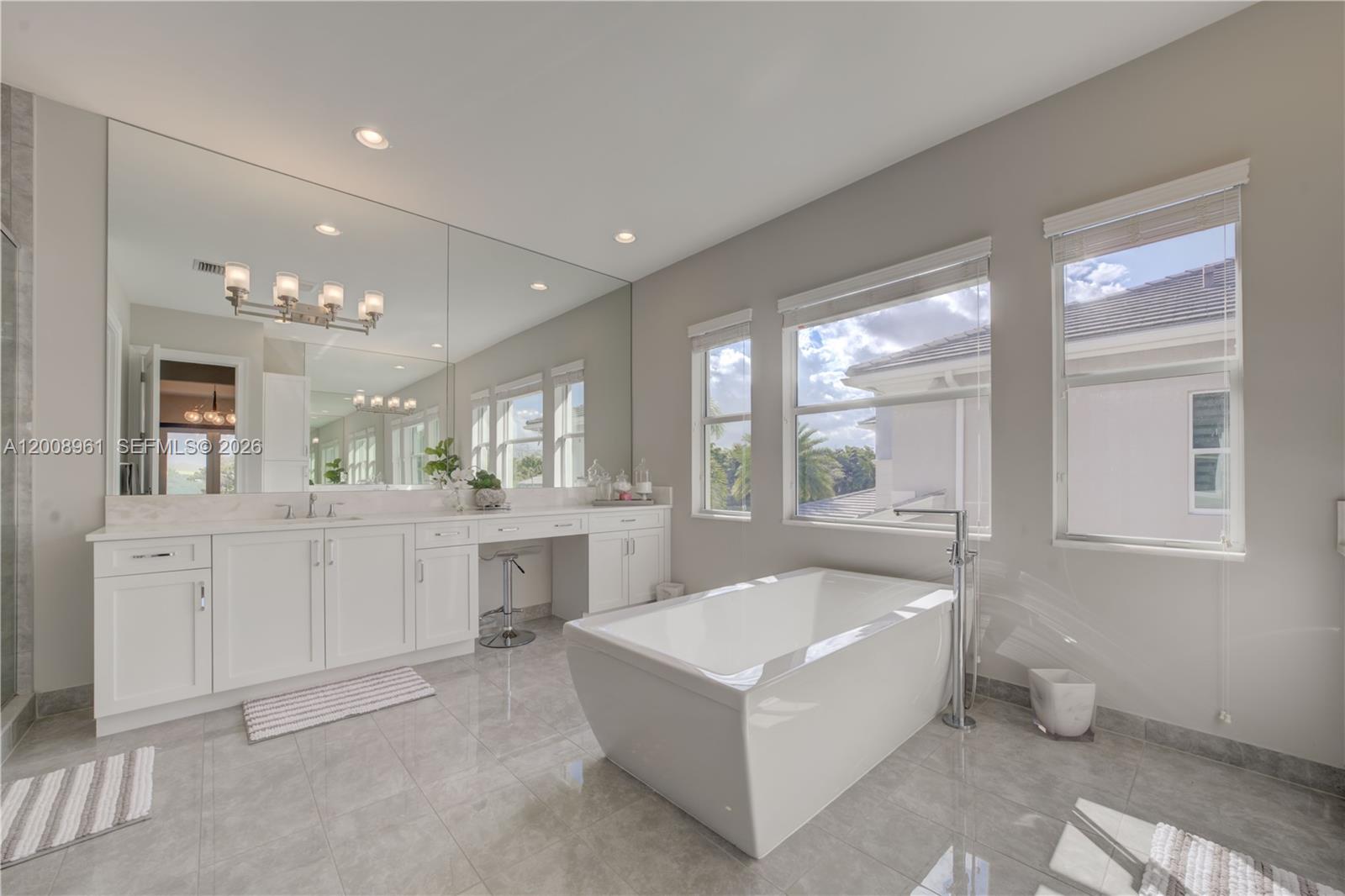 11655 Windy Frst Way Boca Raton, FL 33498 - Photo 42 of 47 a large white bathroom with a large tub and sink