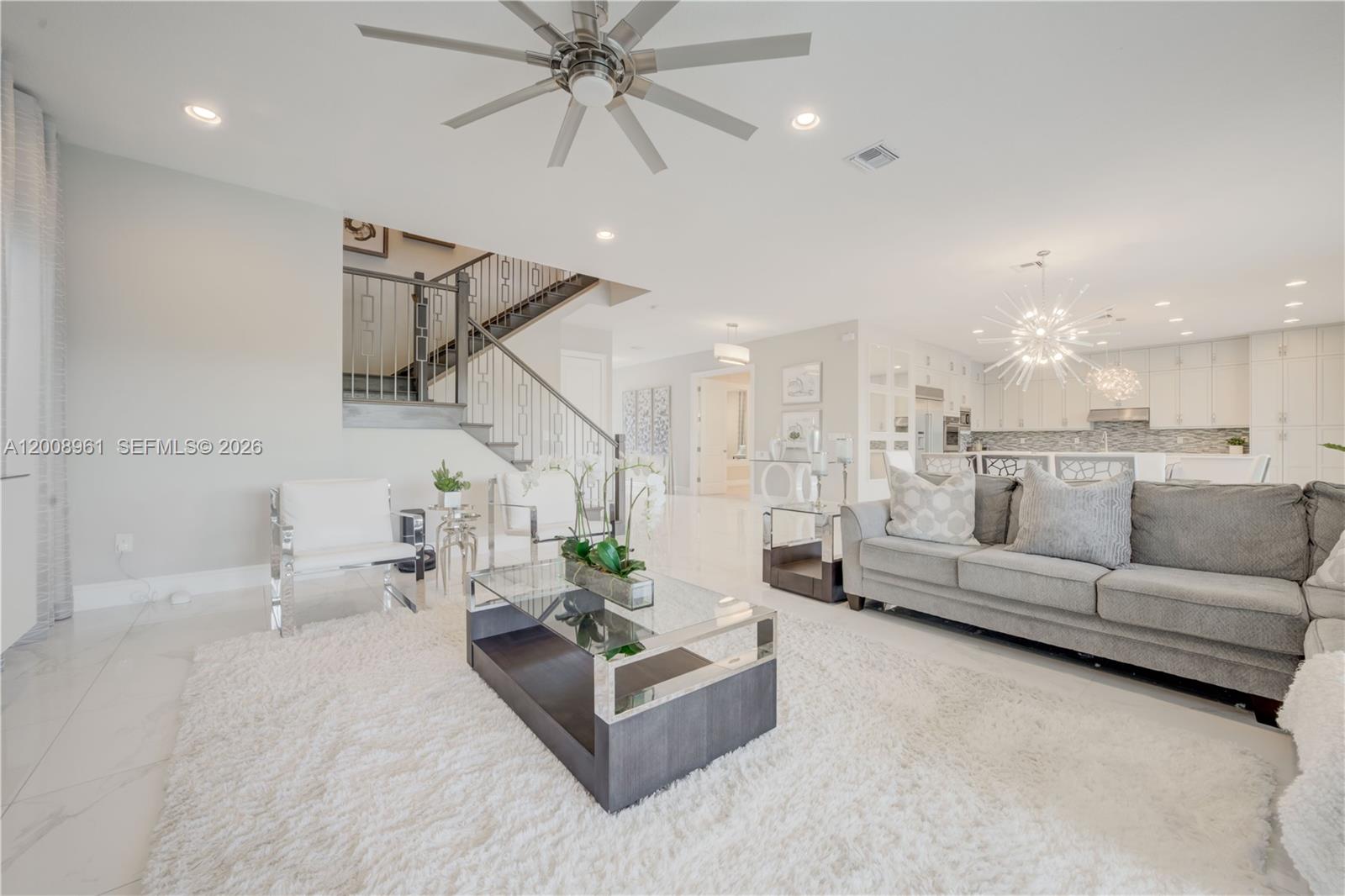 11655 Windy Frst Way Boca Raton, FL 33498 - Photo 8 of 47 a living room with furniture and white walls