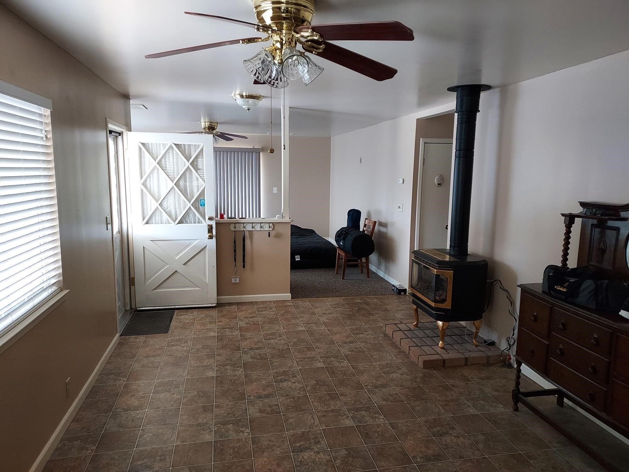 59 Dry Canyon Road Coleville, CA 96107 - Photo 4 of 15 View of side of property with heating fuel, a mountain view, and a metal roof