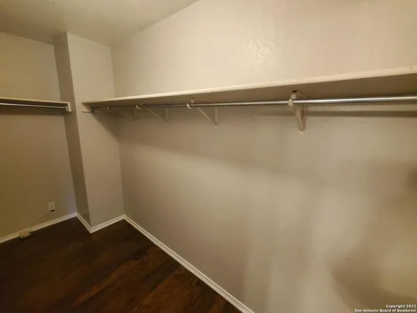 a view of an empty walk in closet