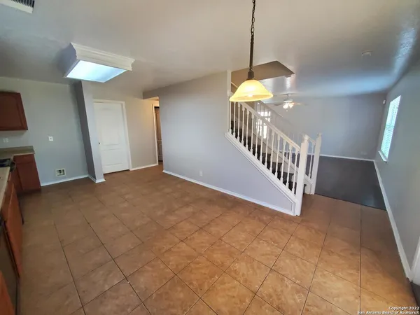 a view of entryway and hall with a chandelier