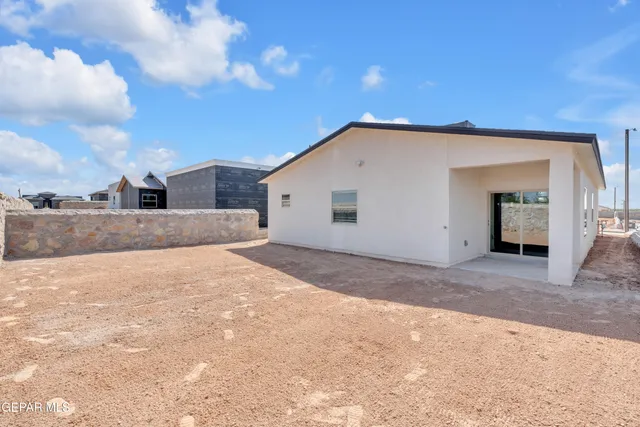 an aerial view of residential building with ocean