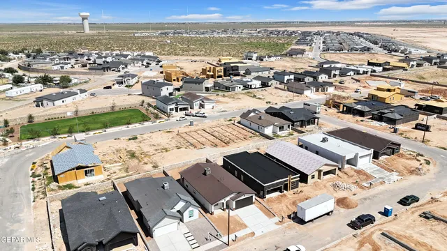 an aerial view of residential building with ocean view