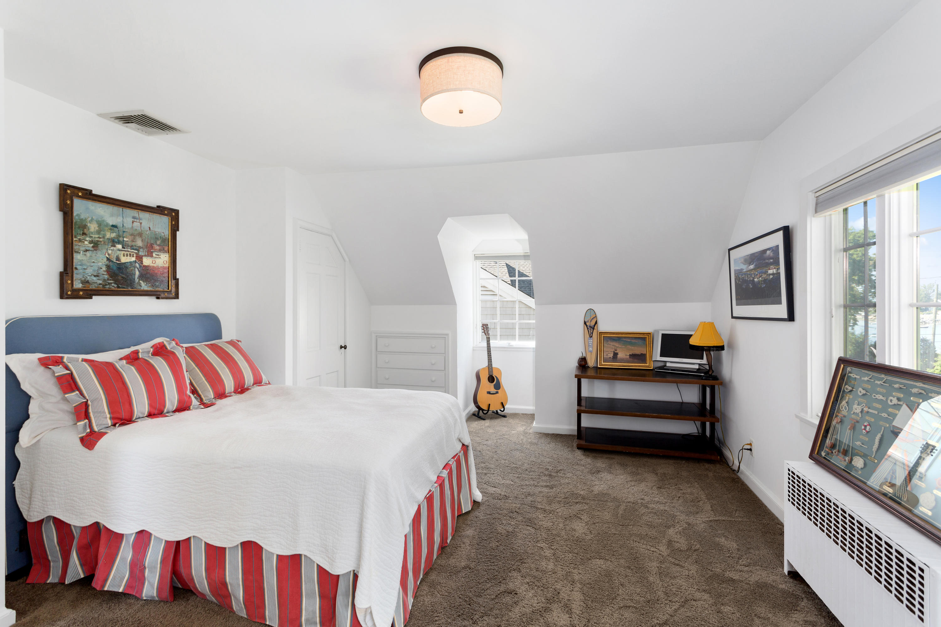 16 Nathan Hale Drive Norwalk, CT 06854 - Photo 18 of 29 a bedroom with a bed and a chandelier