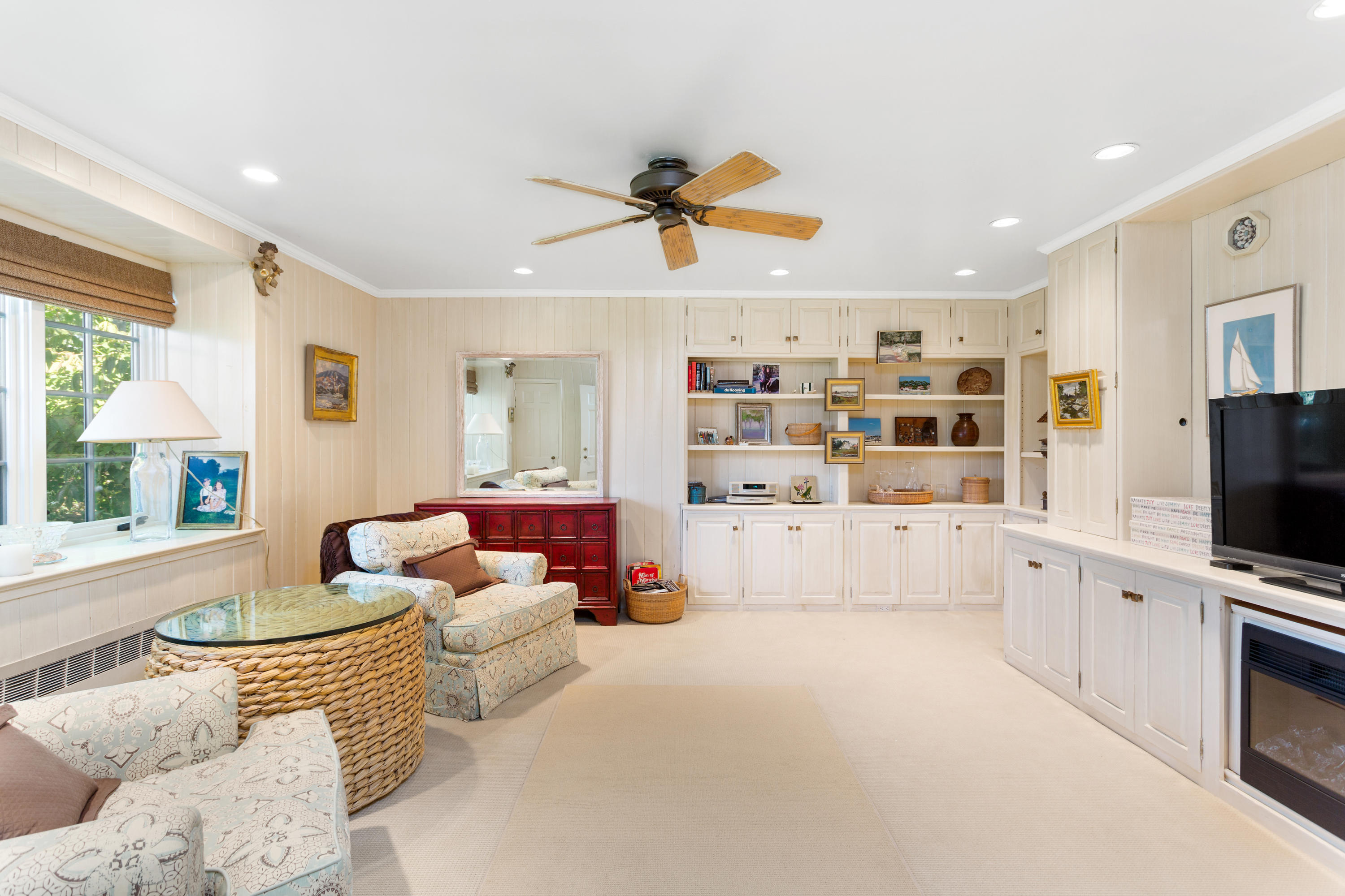 16 Nathan Hale Drive Norwalk, CT 06854 - Photo 20 of 29 a living room with furniture and a flat screen tv