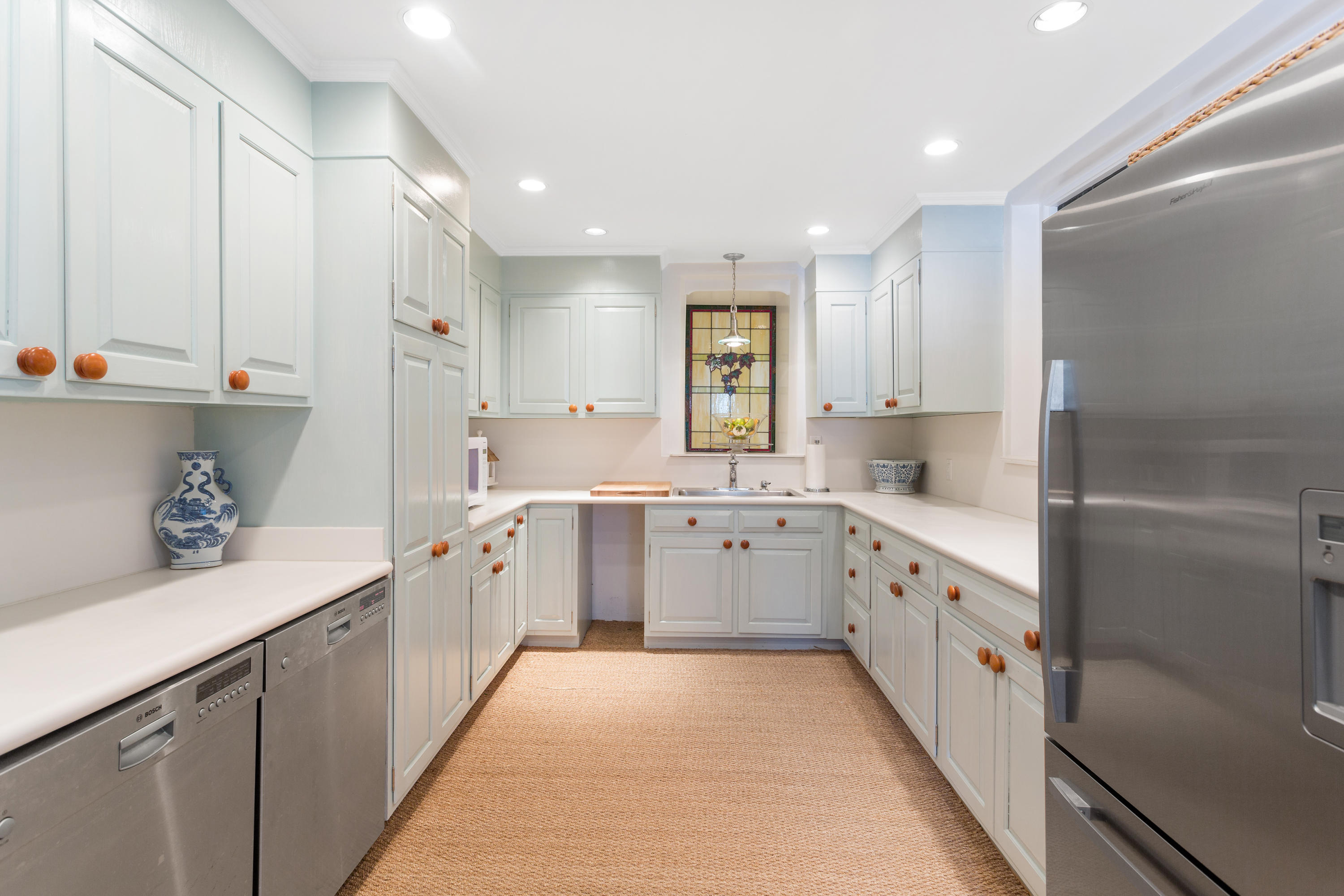16 Nathan Hale Drive Norwalk, CT 06854 - Photo 22 of 29 a kitchen with granite countertop white cabinets and white appliances
