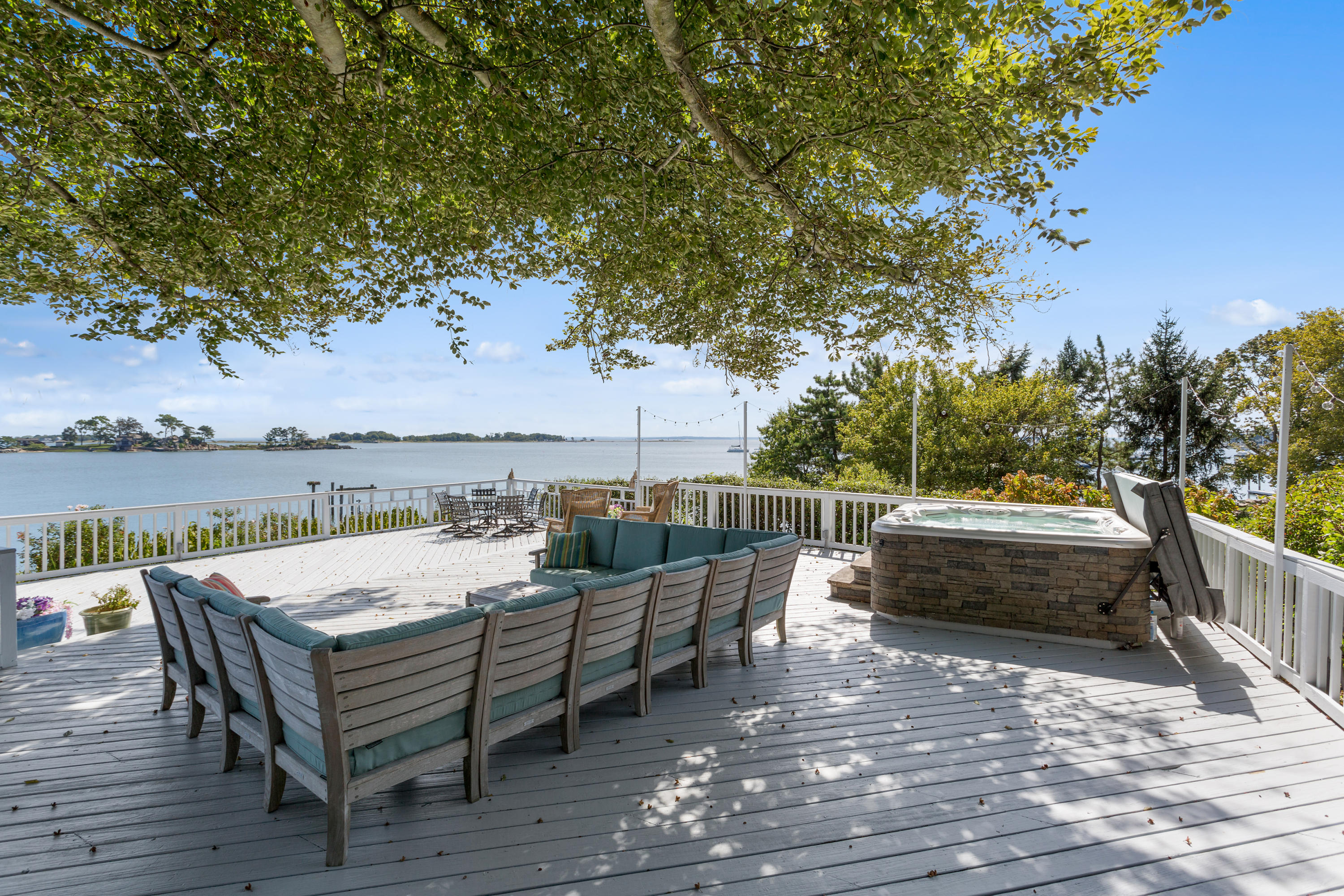 16 Nathan Hale Drive Norwalk, CT 06854 - Photo 25 of 29 an outdoor sitting area with furniture and wooden floor
