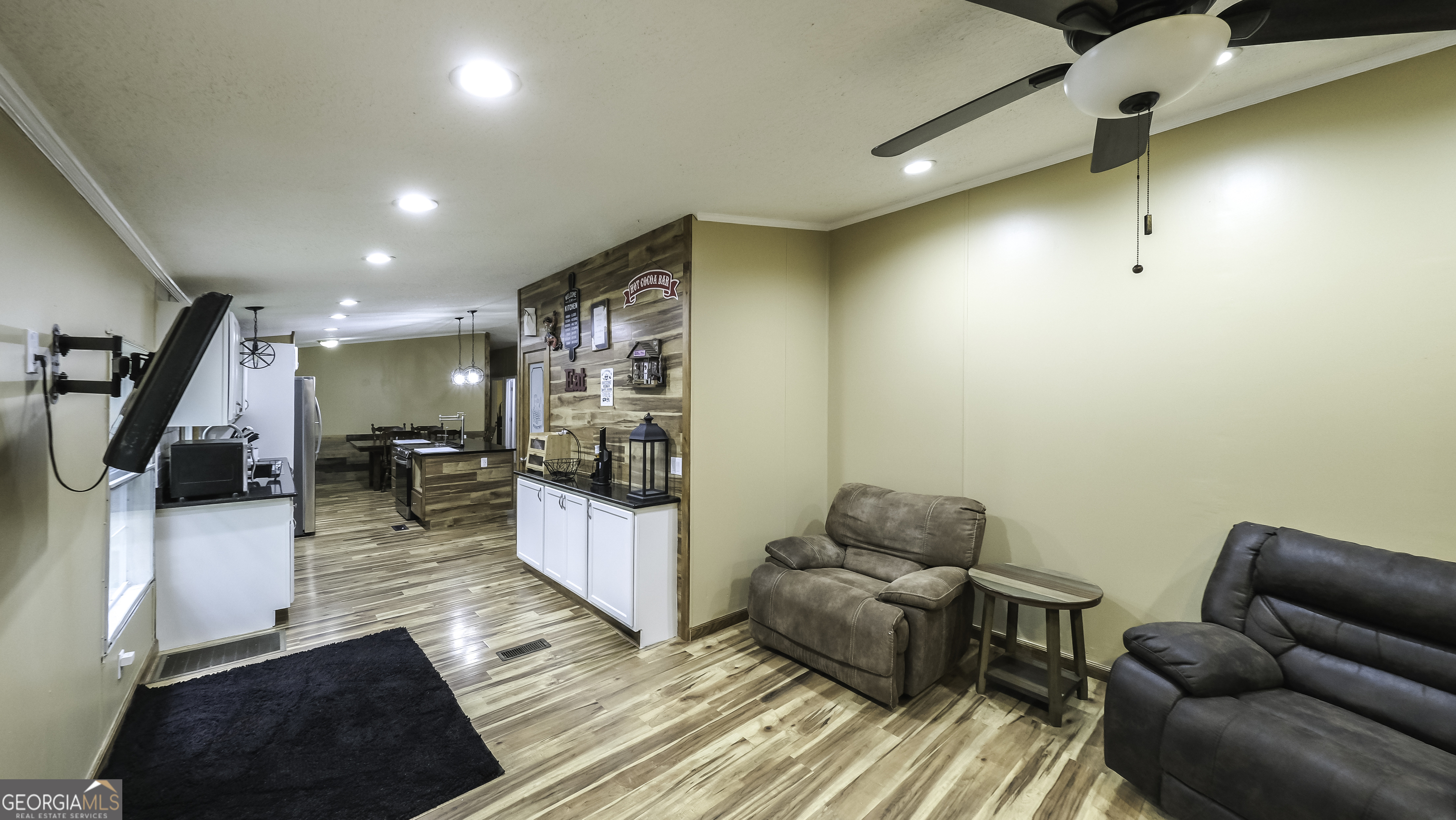 91 Holder Road Temple, GA 30179 - Photo 6 of 40 a living room with furniture and a flat screen tv