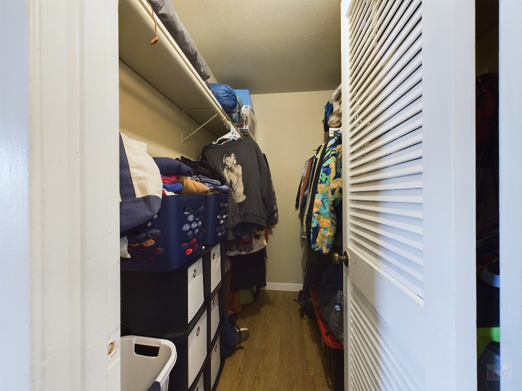 1000 West 26th Street, Unit 118 Austin, TX 78705 - Photo 16 of 18 a view of walk in closet with clothes and shoes