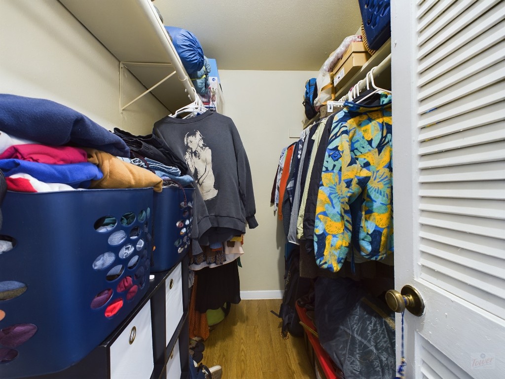 1000 West 26th Street, Unit 118 Austin, TX 78705 - Photo 17 of 18 a view of walk in closet with clothes and shoes