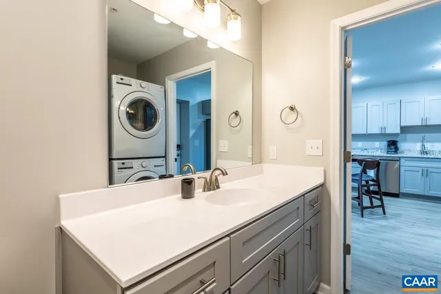 a bathroom with a sink a mirror and a toilet