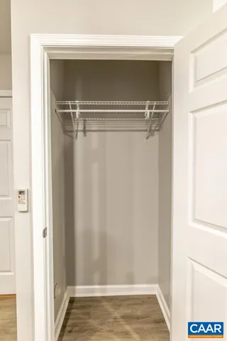 a view of an empty walk in closet
