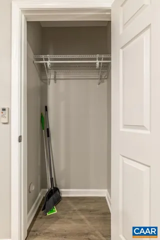 a view of a room with rack and wooden floor