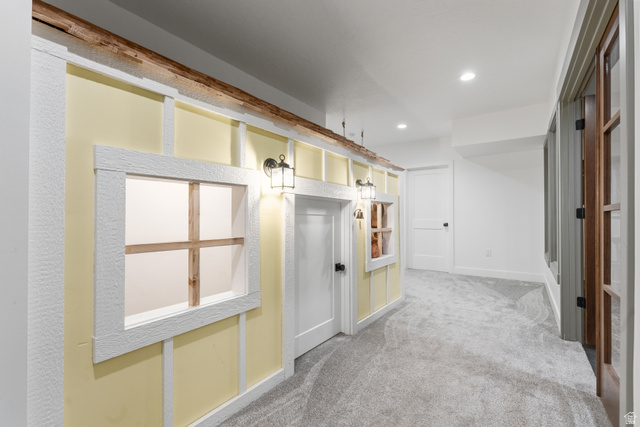 2013 South 100 West Perry, UT 84302 - Photo 30 of 49 Hallway featuring light yellow walls with white trim, wood-look accents, recessed lighting, and grey carpeting