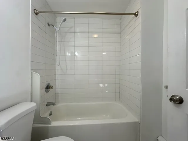 a bathroom with a shower and a bathtub