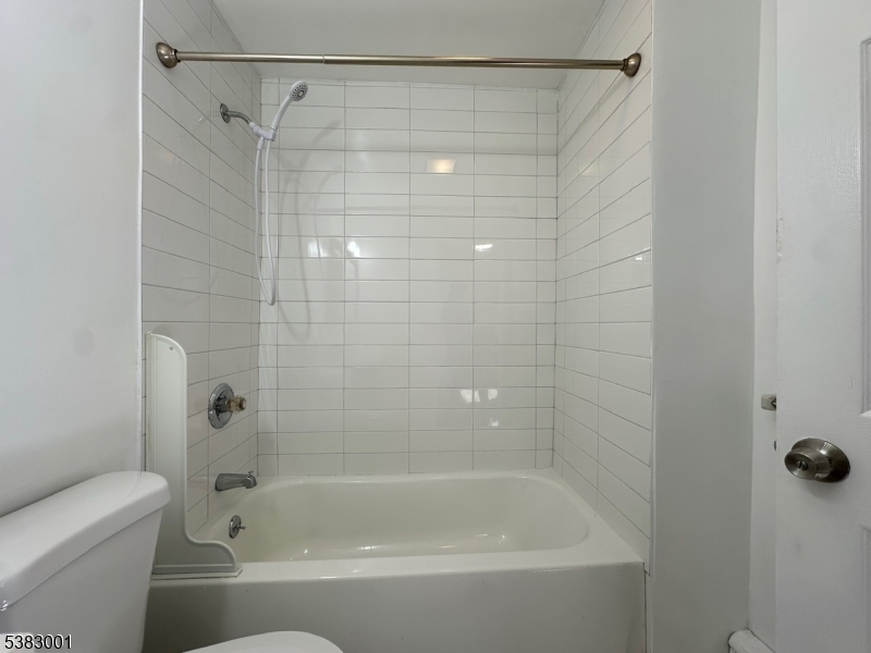 145 Smith Street, Unit 2F Elizabeth, NJ 07201 - Photo 13 of 17 a bathroom with a shower and a bathtub