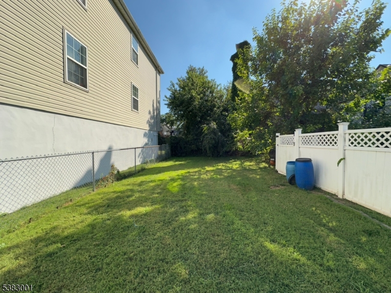 145 Smith Street, Unit 2F Elizabeth, NJ 07201 - Photo 16 of 17 a view of a backyard with small cabin