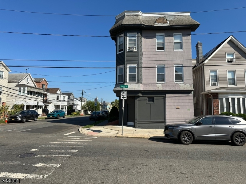 145 Smith Street, Unit 2F Elizabeth, NJ 07201 - Photo 3 of 17 a car parked in front of a house