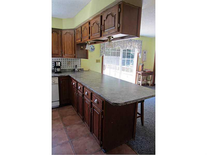 12 Birch Ridge Avenue Topsham, ME 04086 - Photo 8 of 35 Kitchen. The long kitchen peninsula...