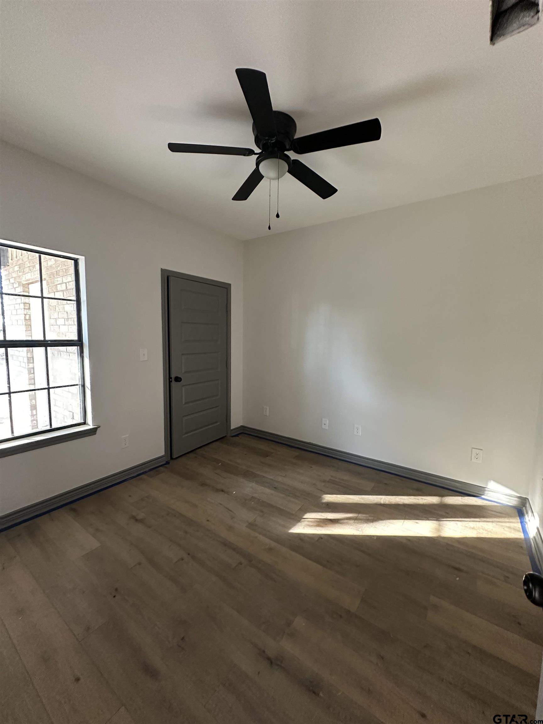 9839 County Road 35 Tyler, TX 75706 - Photo 6 of 12 wooden floor in an empty room