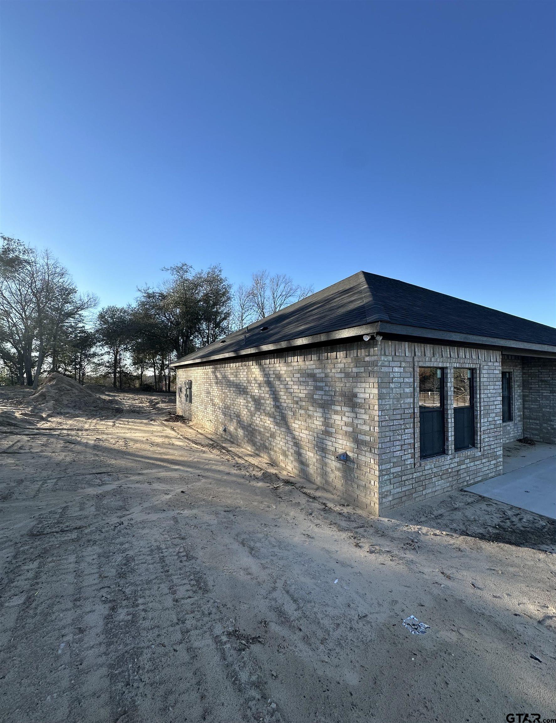9839 County Road 35 Tyler, TX 75706 - Photo 8 of 12 a view of a house with a yard