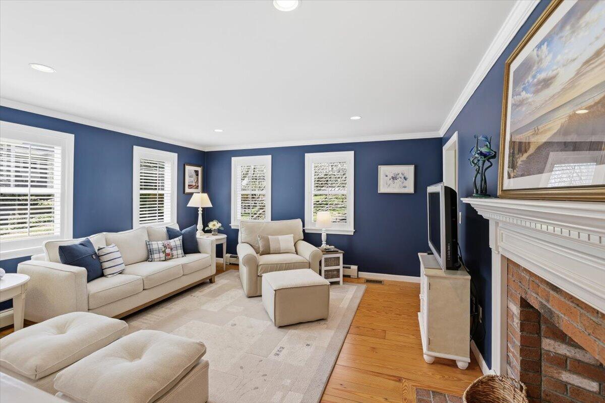 60 Harbor Hill Road Chatham, MA 02633 - Photo 12 of 47 a living room with furniture and a fireplace