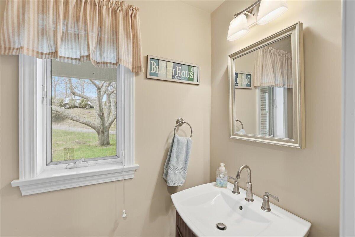 60 Harbor Hill Road Chatham, MA 02633 - Photo 17 of 47 a bathroom with a sink and a mirror