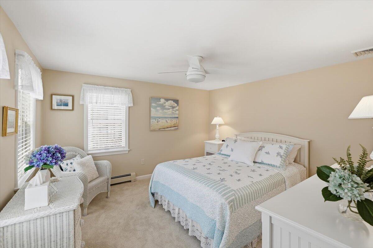 60 Harbor Hill Road Chatham, MA 02633 - Photo 23 of 47 a bedroom with a bed and a couch