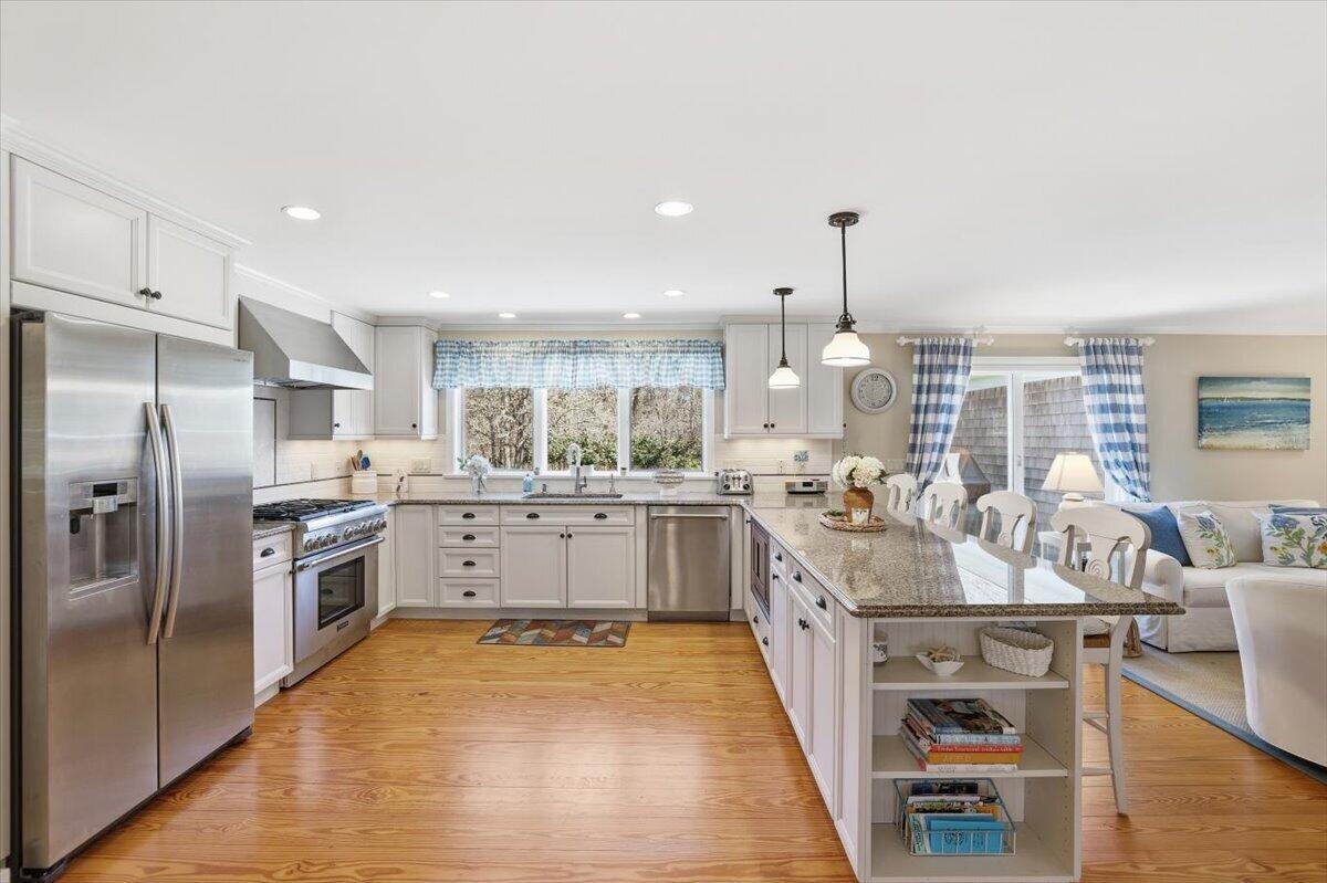 60 Harbor Hill Road Chatham, MA 02633 - Photo 5 of 47 a kitchen with counter top space stainless steel appliances and wooden floor