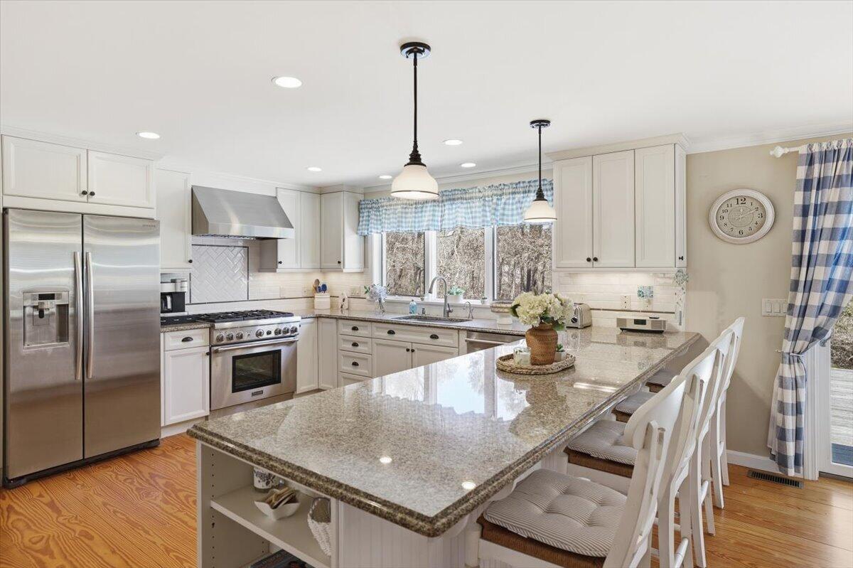60 Harbor Hill Road Chatham, MA 02633 - Photo 6 of 47 a kitchen with stainless steel appliances granite countertop a sink a stove and a refrigerator