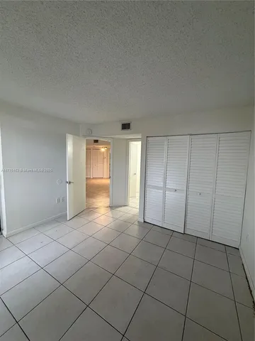 a view of bathroom with a sink and mirror